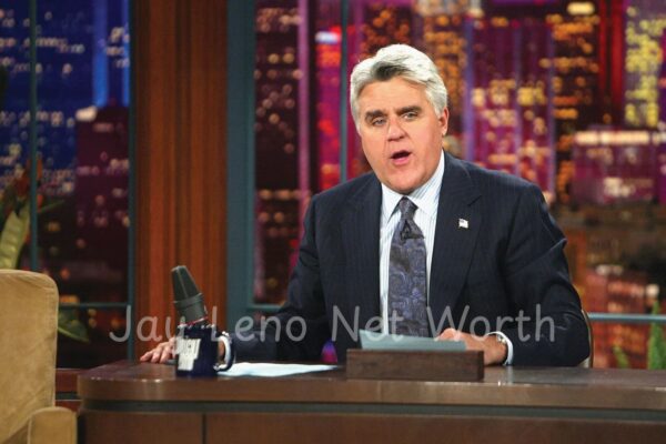 Jay Leno net worth overview with his classic car garage in the background